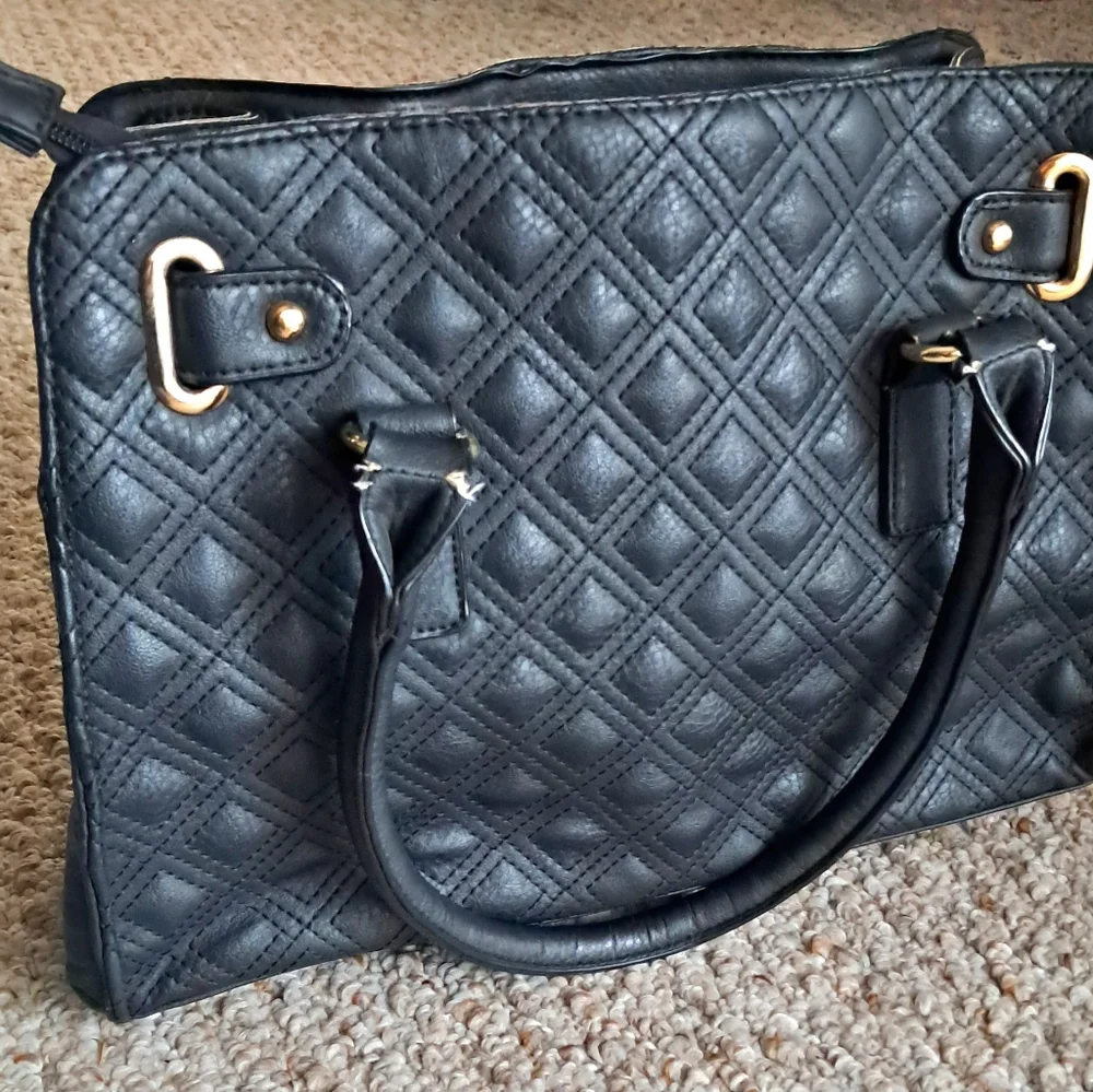 Black Quilted Handbag with Gold Accents